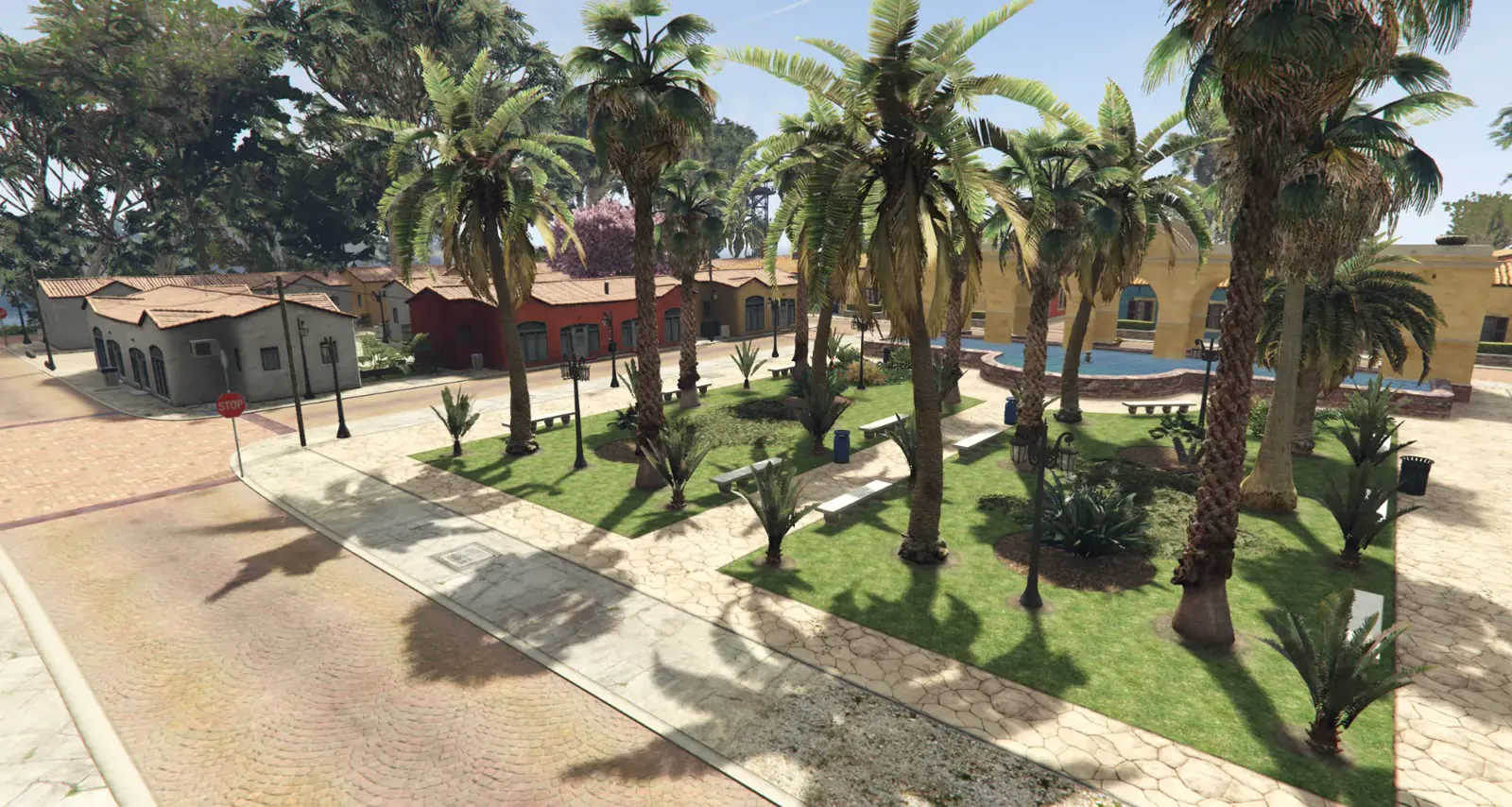The palm-lined square at the centre of Coral Island's new town, with benches, lamp posts and a fountain