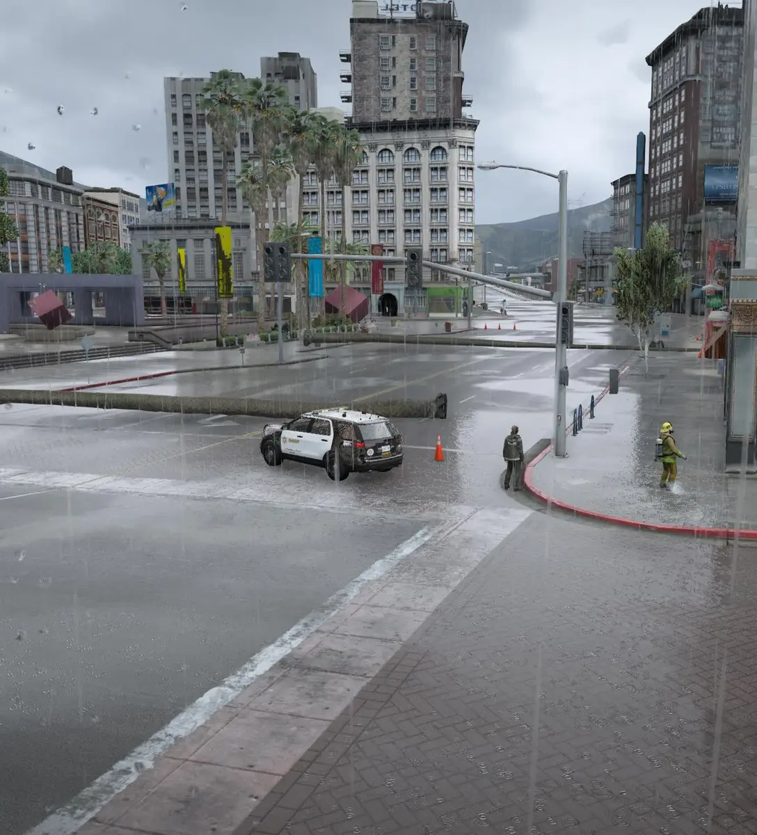Flood responders working a flooded downtown street in the rain